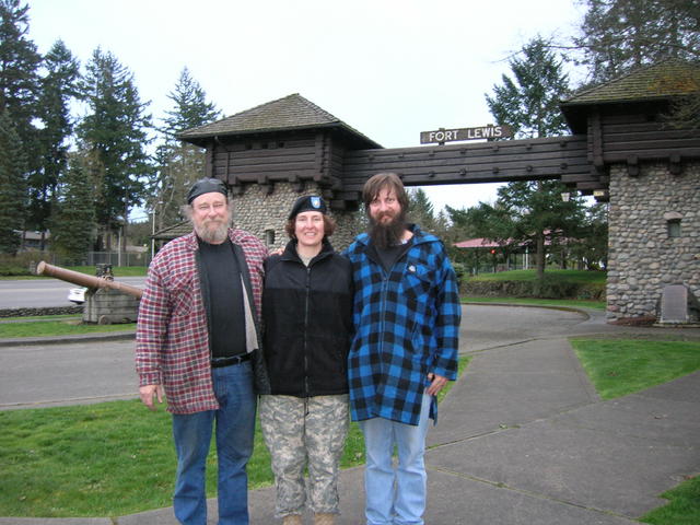 Doug, my sister, and myself in front of the Ft. Lewis sign.  See why they kicked us out?!